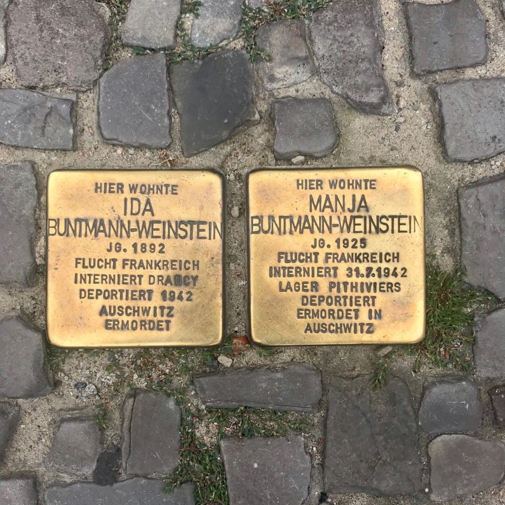 Copper tiles in Berlin that memorialize different Jewish citizens who died during the Nazi era