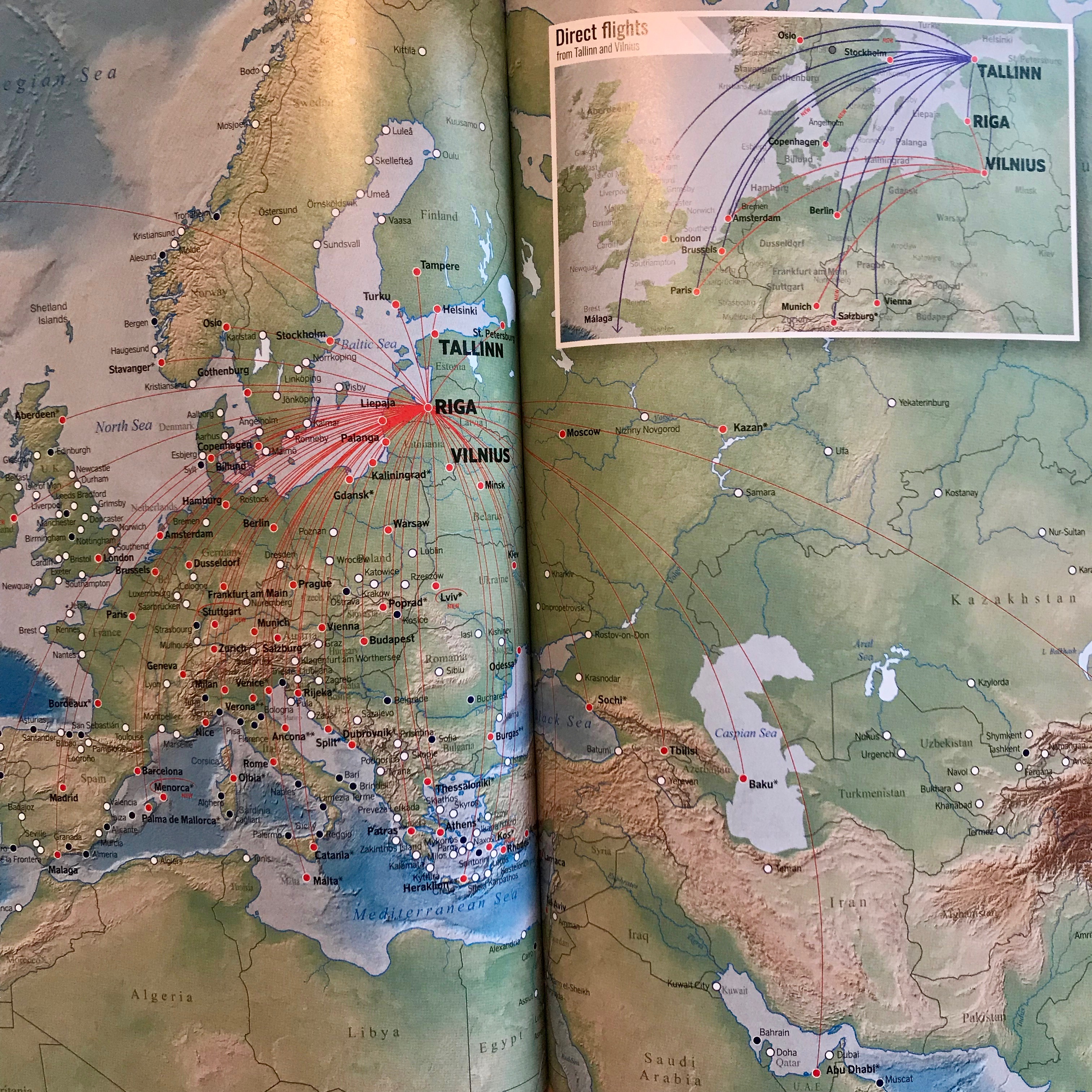 This airBaltic route map is located in the airline in-flight magazine.  There are many dots on the map of various colors depicting the various destinations for the airline, including lines between the prominent hub of Riga, Latvia and each point on the map.  