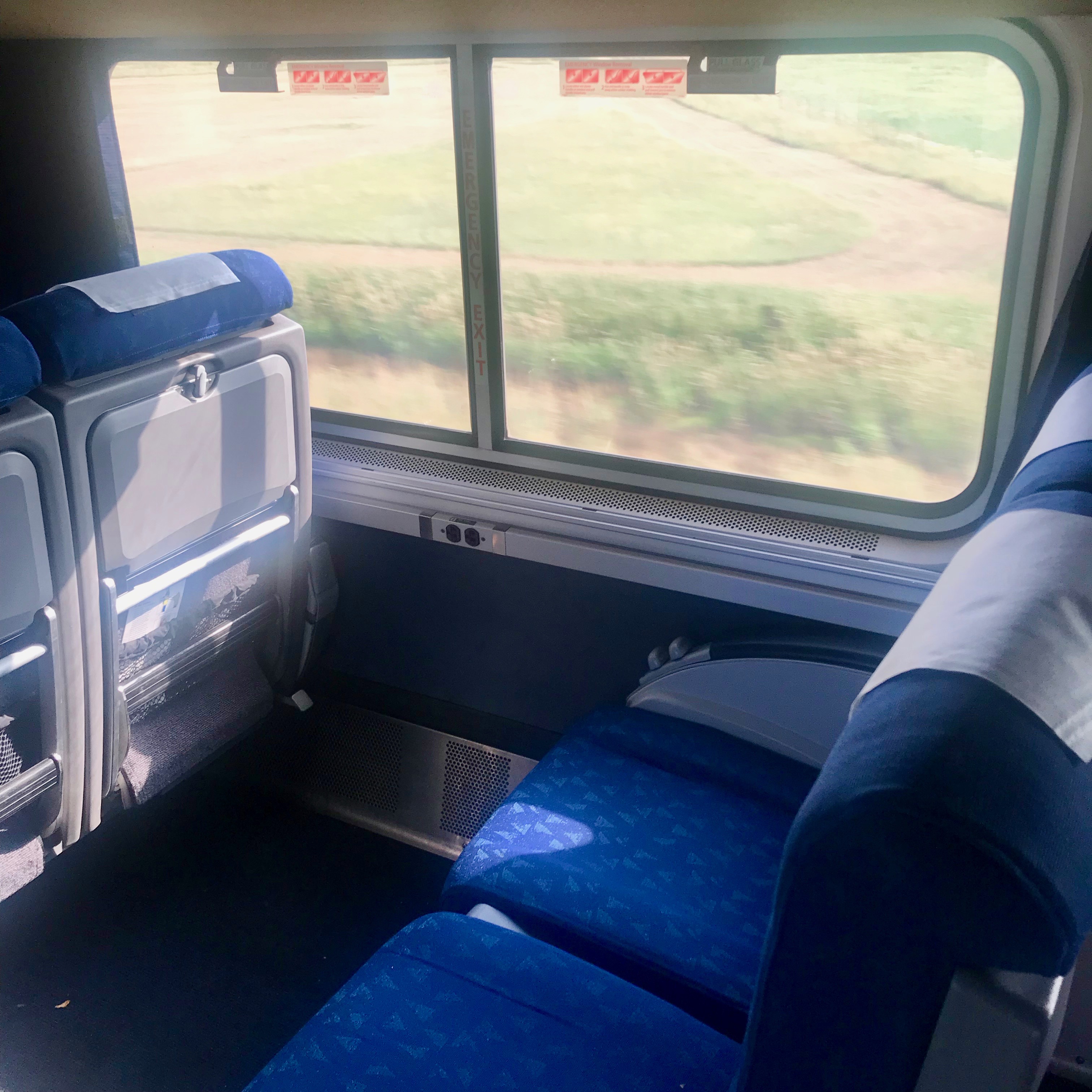 Coach seats on Amtrak Empire Builder train between Seattle and Chicago.  The seats have plenty of legroom and seem to recline enough to sleep over night.  