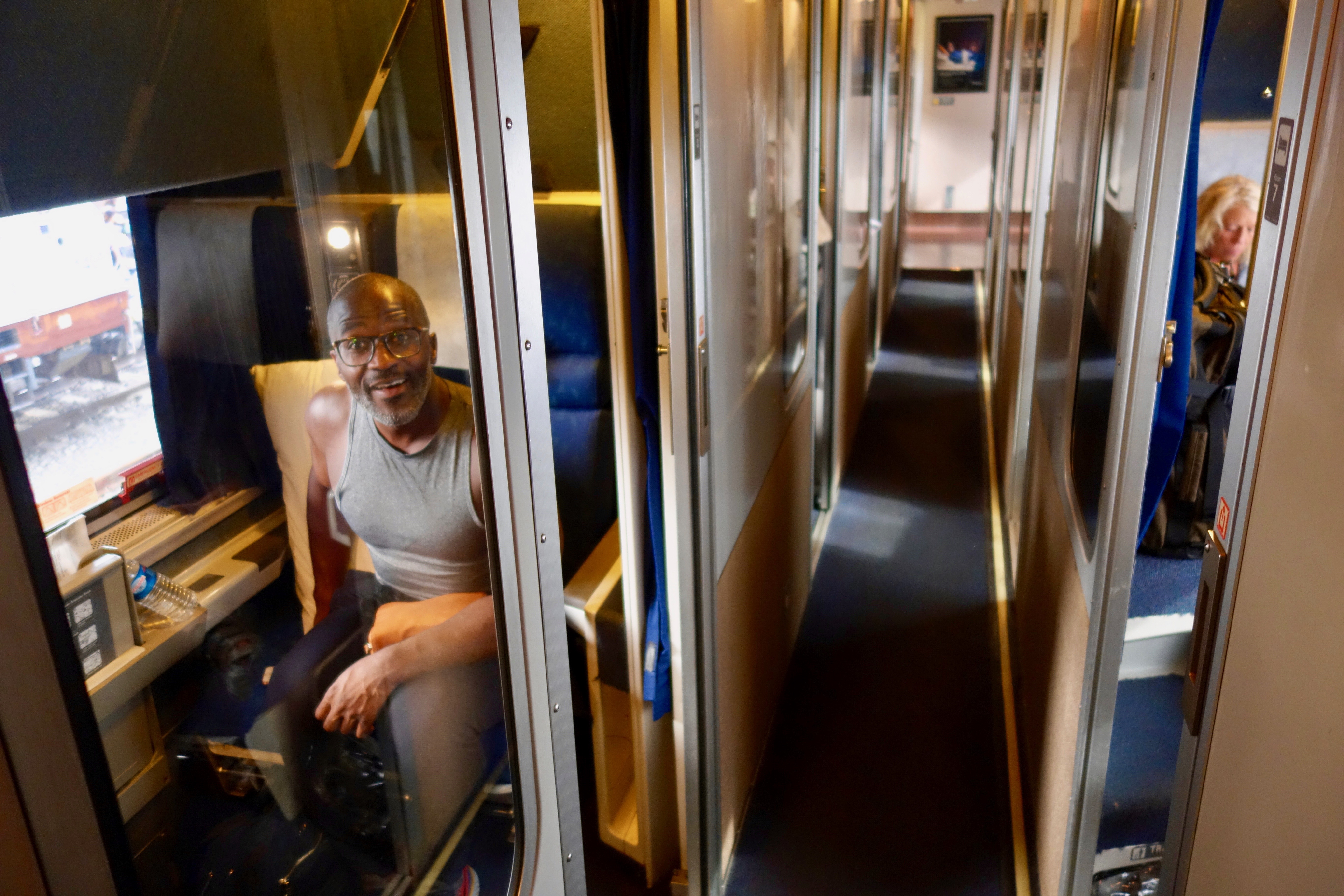 Interior of the sleeping car on Amtrak Empire Builder between Seattle and Chicago.  There are 14 roomettes, shown here, that accommodate two people in a bunk system.  