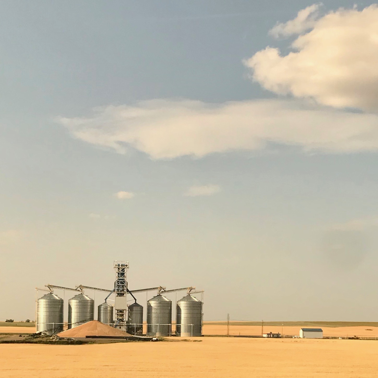 Scenery - grain elevators in eastern Montana from the viewpoint of the long-distance train, Amtrak Empire Builder.  