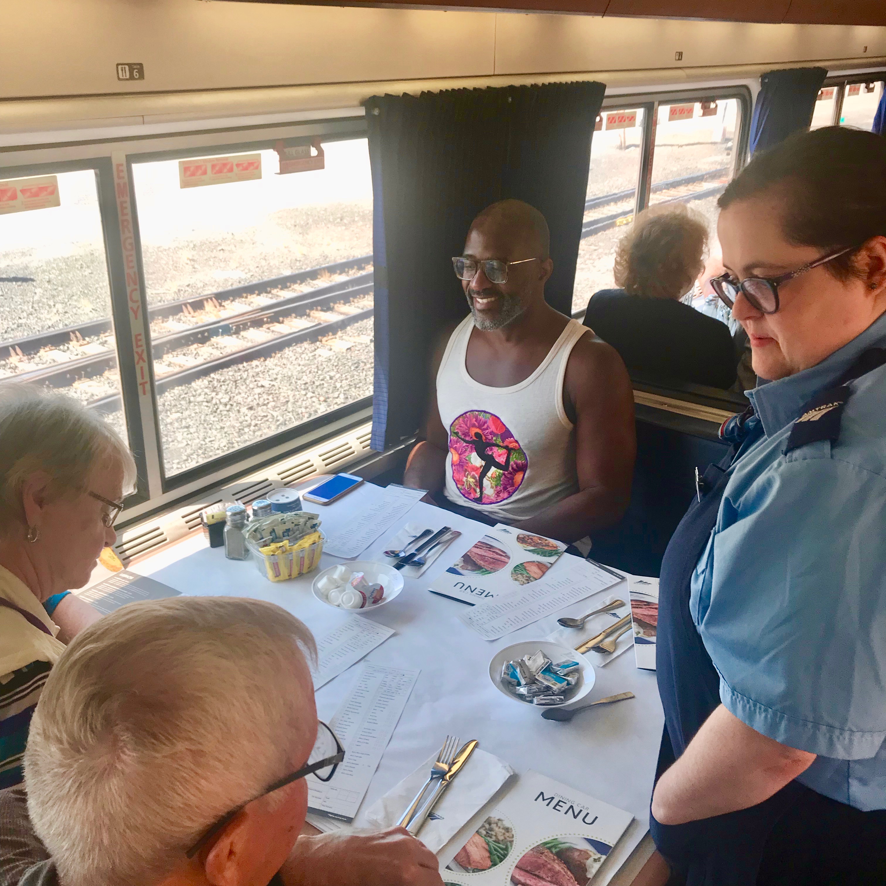 Amtrak Empire Builder Dining Car.  Long-Distance trains like this one between Seattle and Chicago have full meal service, and passengers are combined in the booths for 4 people. 