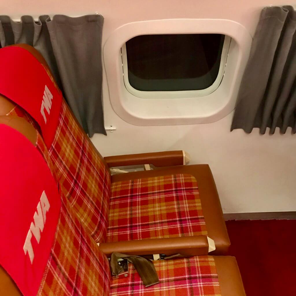 There is a cocktail lounge inside a vintage TWA Super Constellation on display steps away from the new TWA Hotel. Every detail is covered, including red carpet, stir sticks and themed cocktail menus.