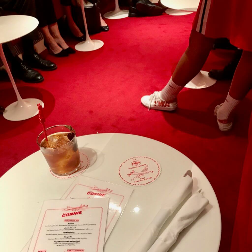 There is a cocktail lounge inside a vintage TWA Super Constellation on display steps away from the new TWA Hotel. Every detail is covered, including red carpet, stir sticks and themed cocktail menus.