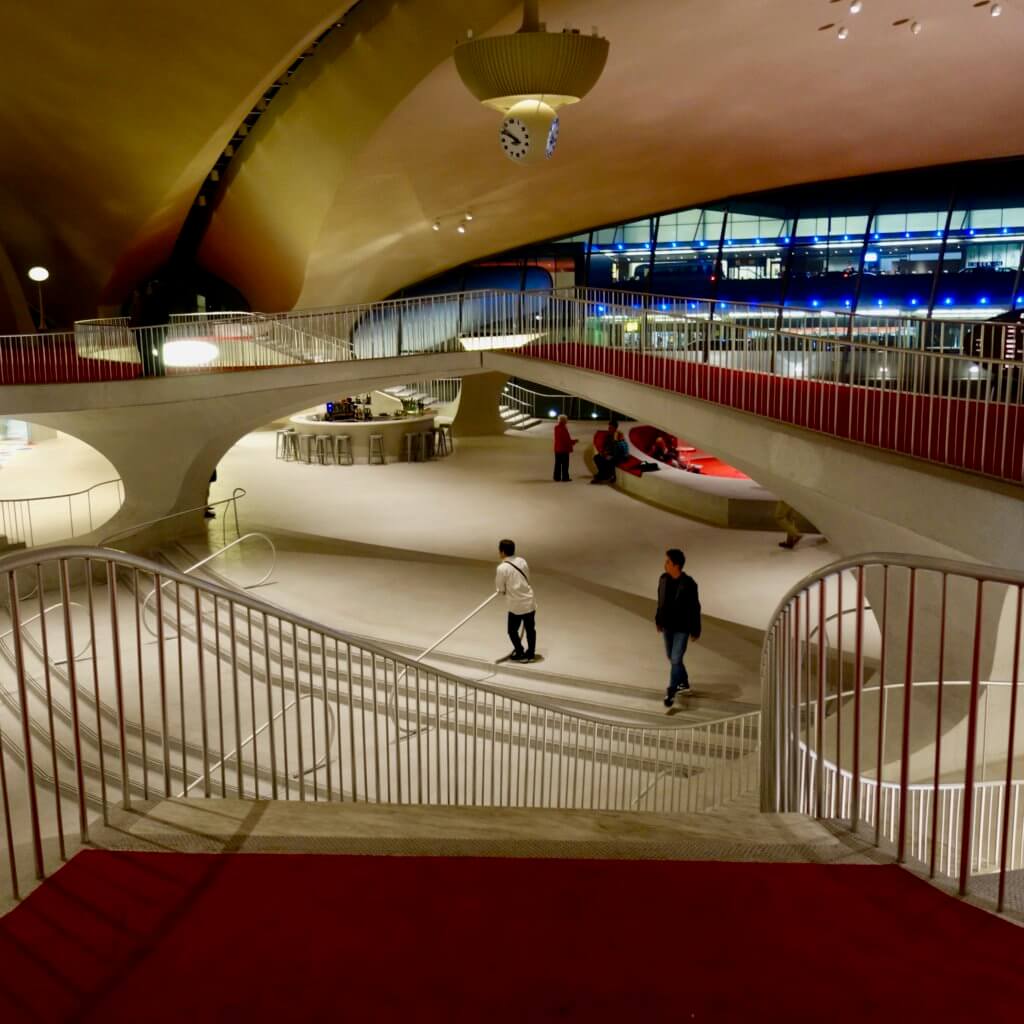 Mezzanine level with iconic TWA red carpet inside the historic Eero Saarinen JFK Airport Terminal completed in 1962 for TWA.