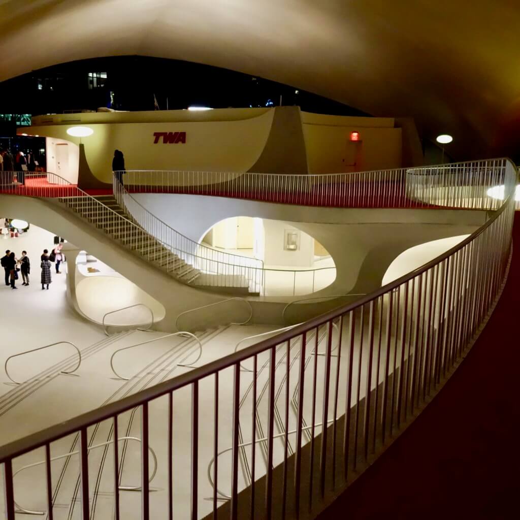 Mezzanine level with iconic TWA red carpet inside the historic Eero Saarinen JFK Airport Terminal completed in 1962 for TWA.
