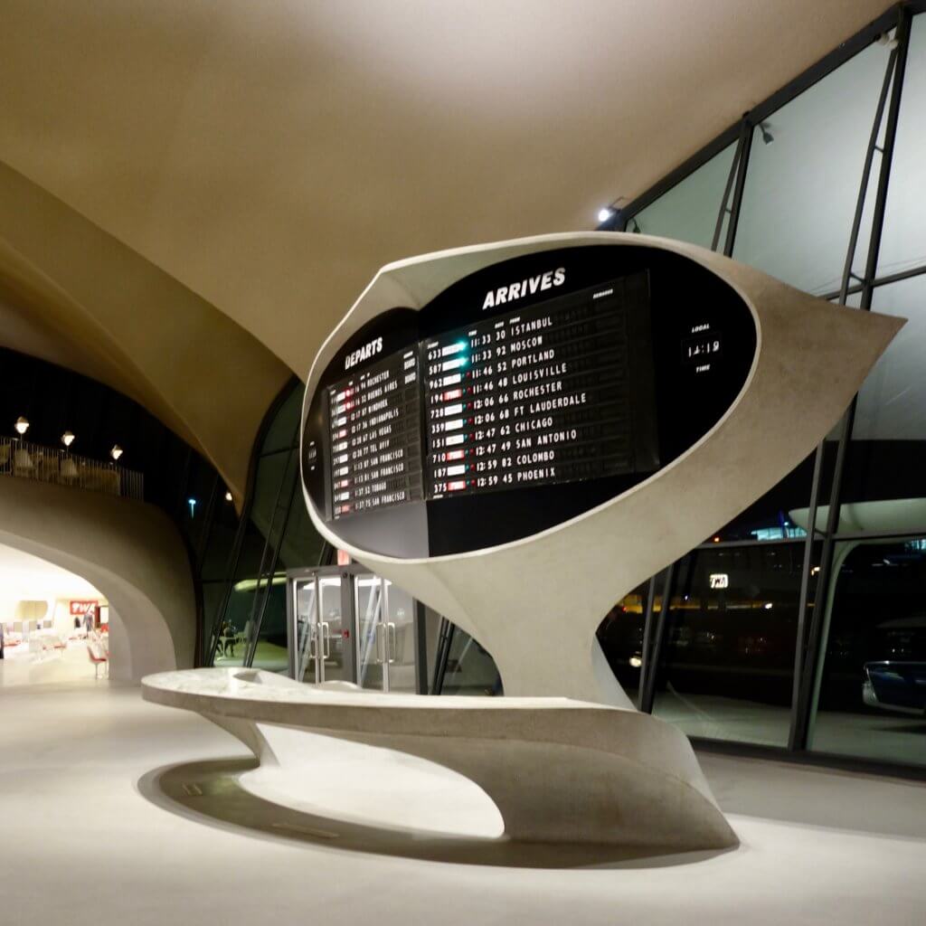 The flight display greeting travelers in the entrance to the historic Eero Saarinen JFK Airport Terminal completed in 1962 for TWA.