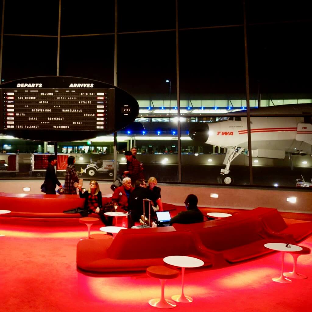 The sunken lounge in the central part of the TWA Hotel which now operated in the historic JFK terminal building designed by Eero Saarinen.