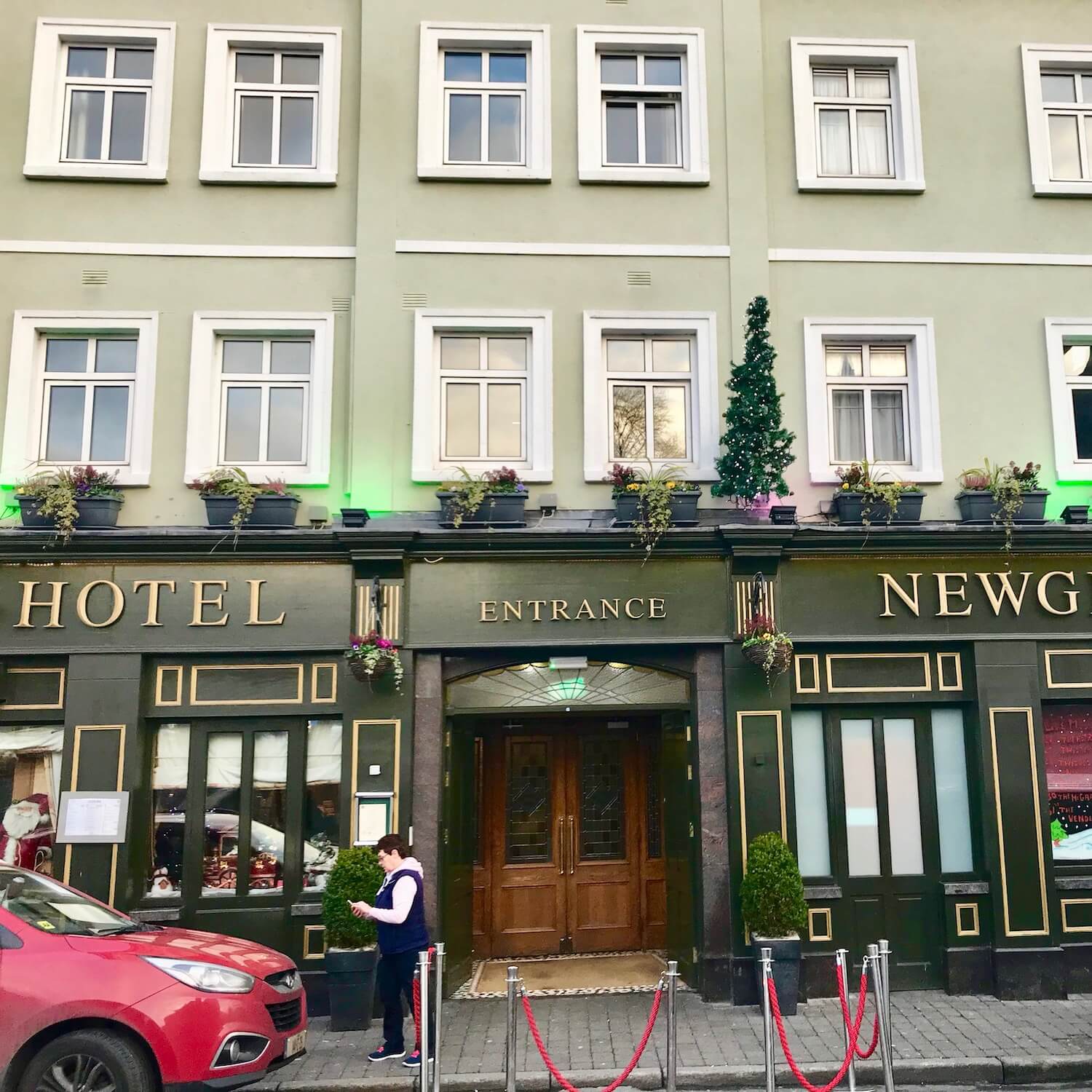The Newgrange Hotel is painted two deep shades of green and centrally located in downtown Navan, Ireland.