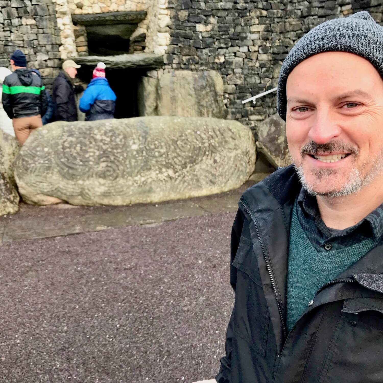 Newgrange Ireland winter solstice experience.  Smiling outside the entrance to the cavern that is deep inside the Newgrange mound.