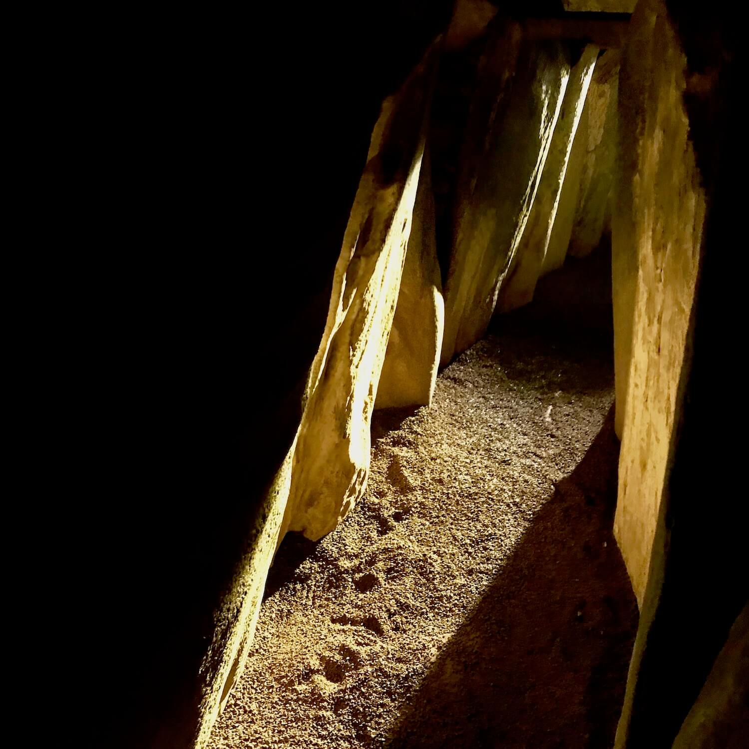Newgrange Ireland winter solstice rays creep into the chamber deep inside the watertight chamber.