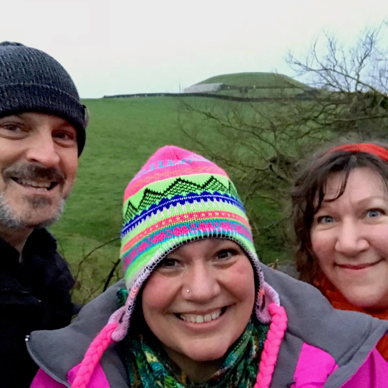 My new friends and I pose for a selfie with Newgrange mound off in the distance.
