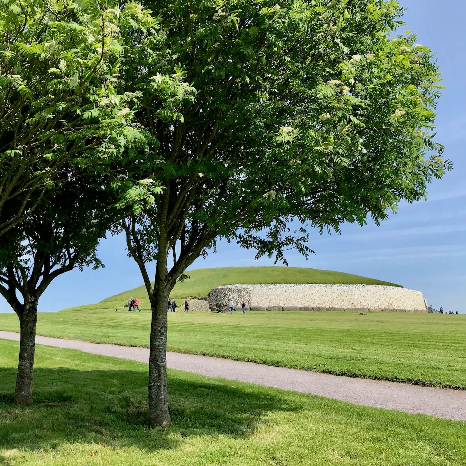 Newgrange Ireland is an ancient site with a large mound of rocks covered by a grassy knoll.  The winter solstice experience is mystical. 