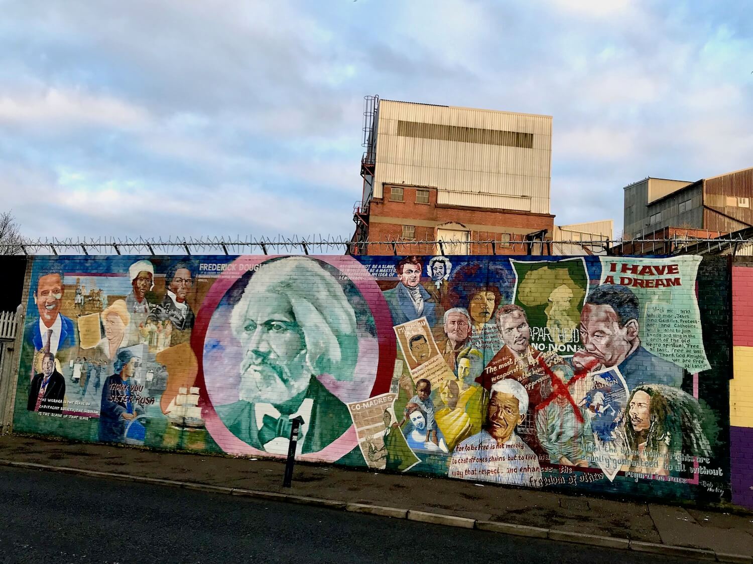 One of the many fences dividing the politics in Belfast with murals depicting various icons of liberation in the midst of oppression.