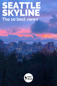 A beautiful winter scene viewing from the Volunteer Park Water Tower at sunset. This view of Seattle shows dark deciduous and fir trees with a layer of dusk lighted downtown office buildings while the bright orange sun sets amongst purple and blue clouds.