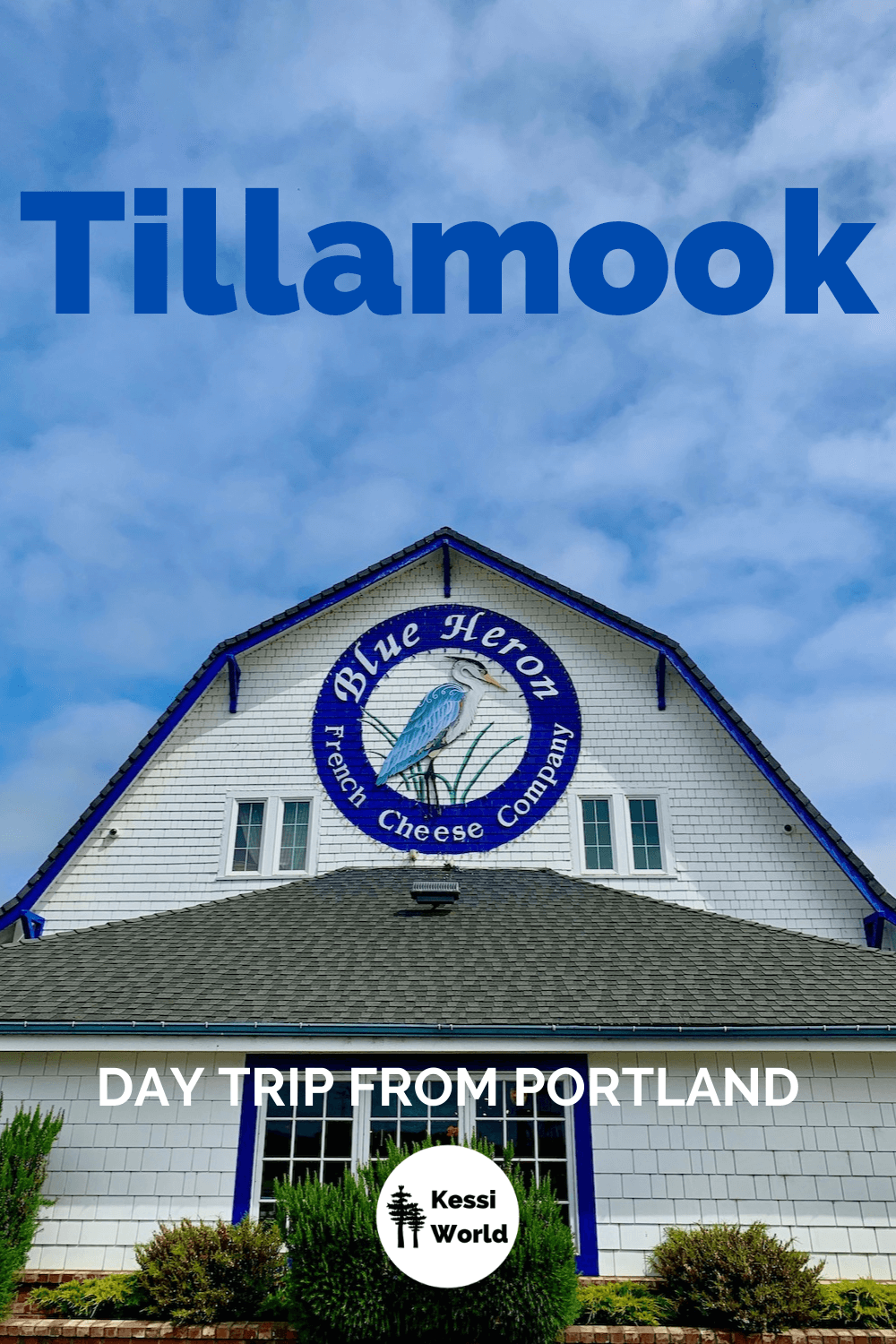 This Pinterest tile shows Blue Heron French Cheese Company is a whimsical barn painted a fresh white with French blue trim around the windows and dutch revival roof line. The plants in the front are bright green and the sky is blue. Tillamook makes a great day trip from Portland, Oregon