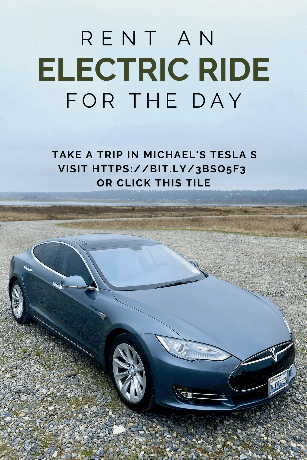 This Pinterest pin shows a Tesla S series parked at the beach on a bed of pebbly shore rocks with flat coastal lands in the background under a gray sky.