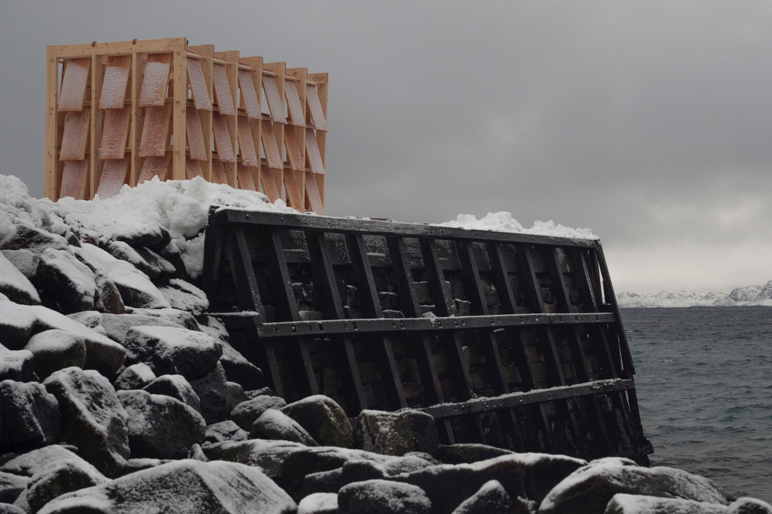 Greenland Qamutit Sled House sits atop a harbor platform in the town of Nuuk, Greenland. 