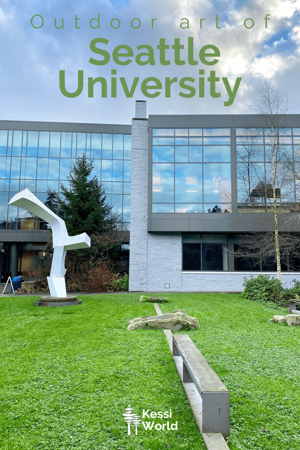 This Pinterest pin shows Art at Seattle University in the middle of the grass covered quad area. A large metallic sculpture is the centerpiece against shiny glass windows of the student union building.