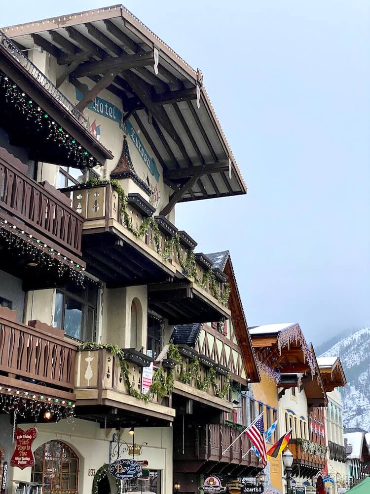 The wide awnings of buildings in downtown Leavenworth highlight the German theme of the town, with holiday lights still dripping from the wooden deckings, ornate with carved designs.  