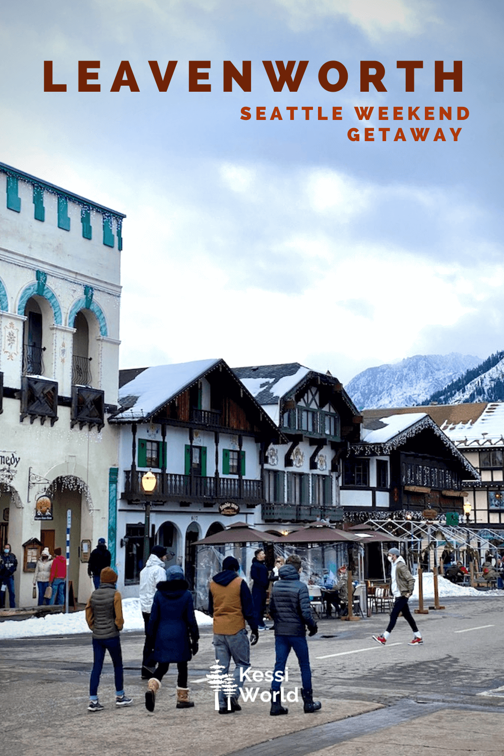 This Pinterest pin depicts people walking in the downtown core of the Bavarian themed town in the Cascade Mountains on a Seattle weekend getaway to Leavenworth, Washington.  The buildings are all German in theme and still covered in holiday lights.  