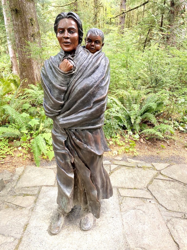 Pacific Northwest travel offers many ways to learn more about the people who inhabited this land for millennia before the first settlers. Here is a bronze statue of Sacagaweja, known for being instrumental in assisting the Lewis and Clark expedition.