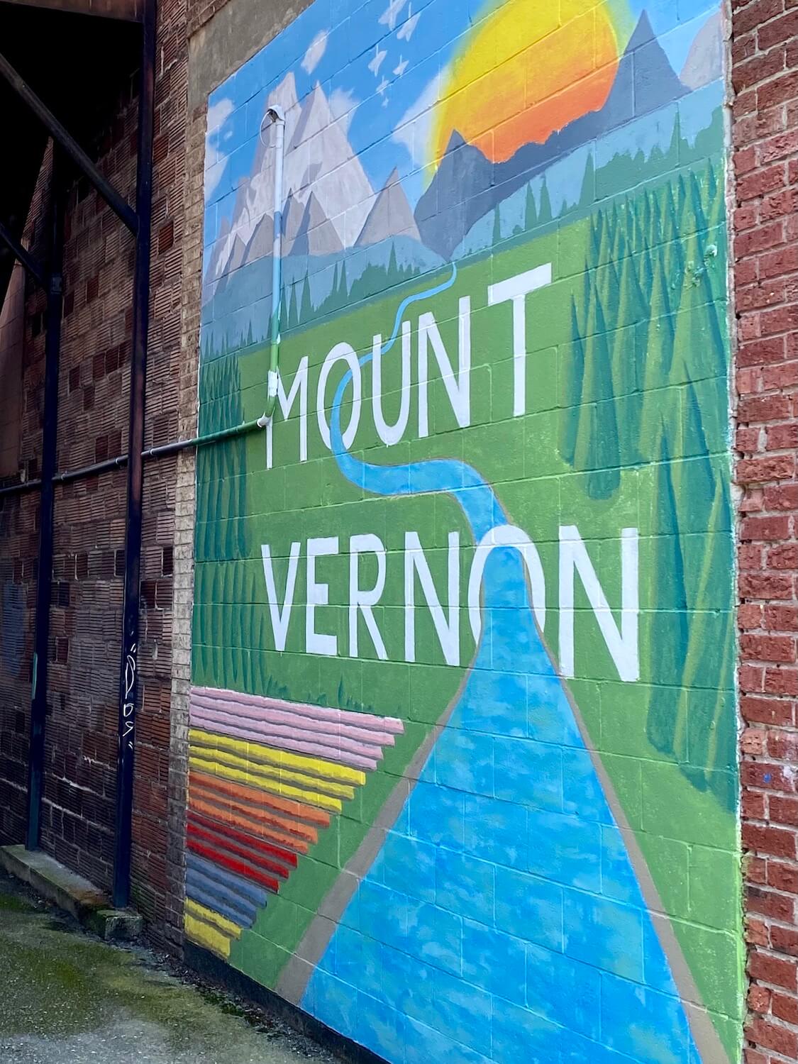 Mount Vernon Washington makes for a great stop along the Seattle to Vancouver drive because it's about halfway and there are some neat shops and restaurants. This mural on the side of a red brick building depicts the colorful nature of Mount Vernon.