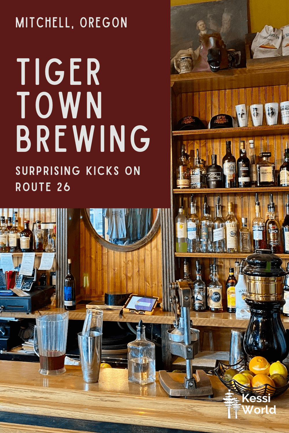 The fully stocked bar of Tiger Town Brewing, complete with a number of high end whiskey bottles and fresh citrus in a black wire basket on the counter.  