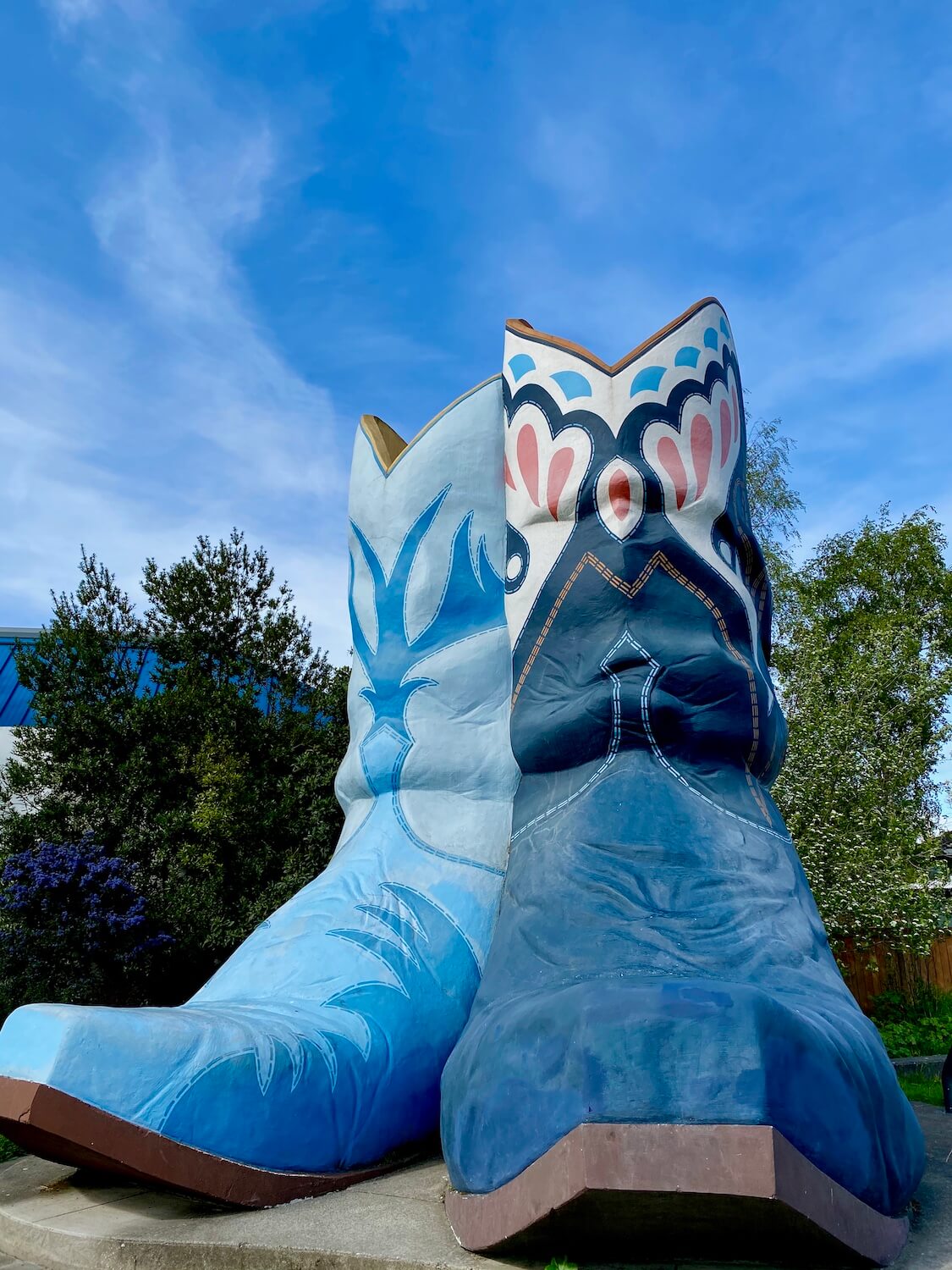 Boots and hat park in Georgetown neighborhood of Seattle reveals giant cowboy boots painted various shades of blue.  This photo represents the Fool in the Major Arcana of the tarot.