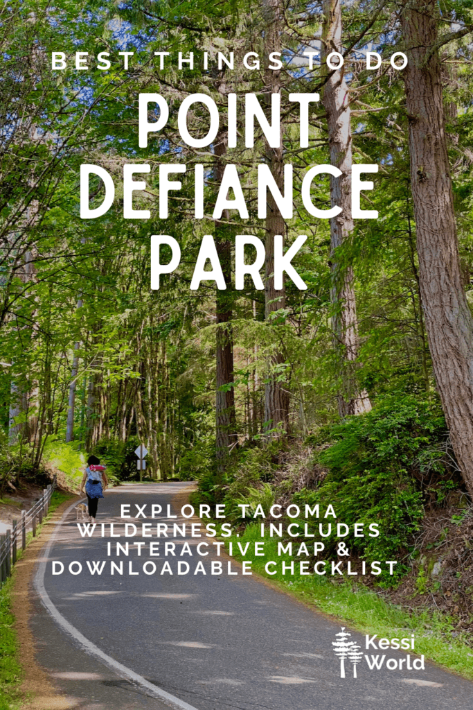 This Pinterest pin shows a woman walking up the road that makes up Five Mile Drive at Point Defiance Park.  The road is paved and covered by towering trees with varieties of green leaves.