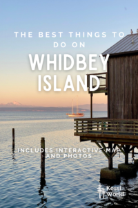 This Pinterest Pin outlines things to do on Whidbey Island and shows a wood building on stilts overhanging the Salish Sea while the sun sets in the background with hues of purple and pink.