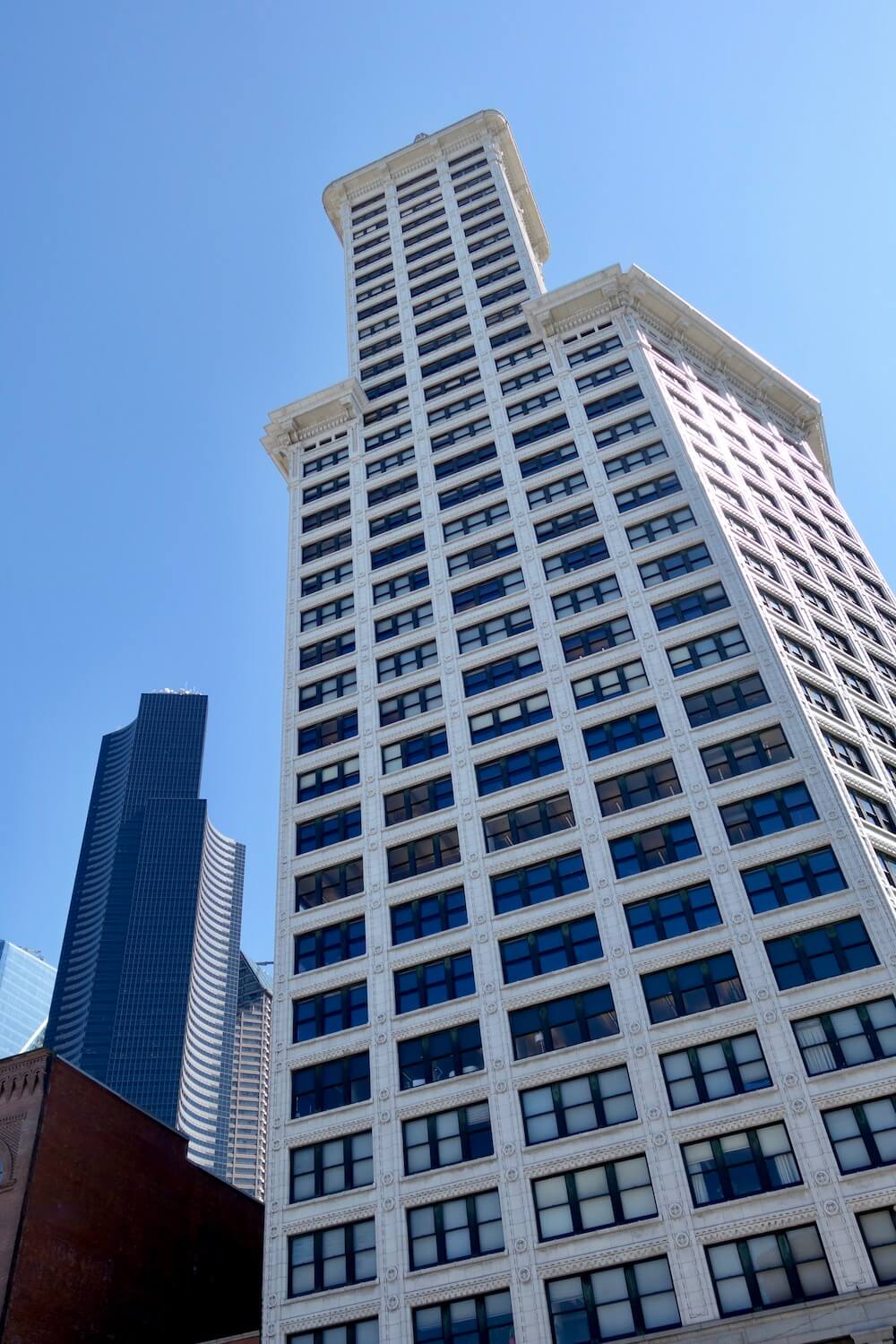 Smith Tower in Seattle rises up around other larger buildings, but this angle makes it seem like the early 1900's structure is the biggest.  