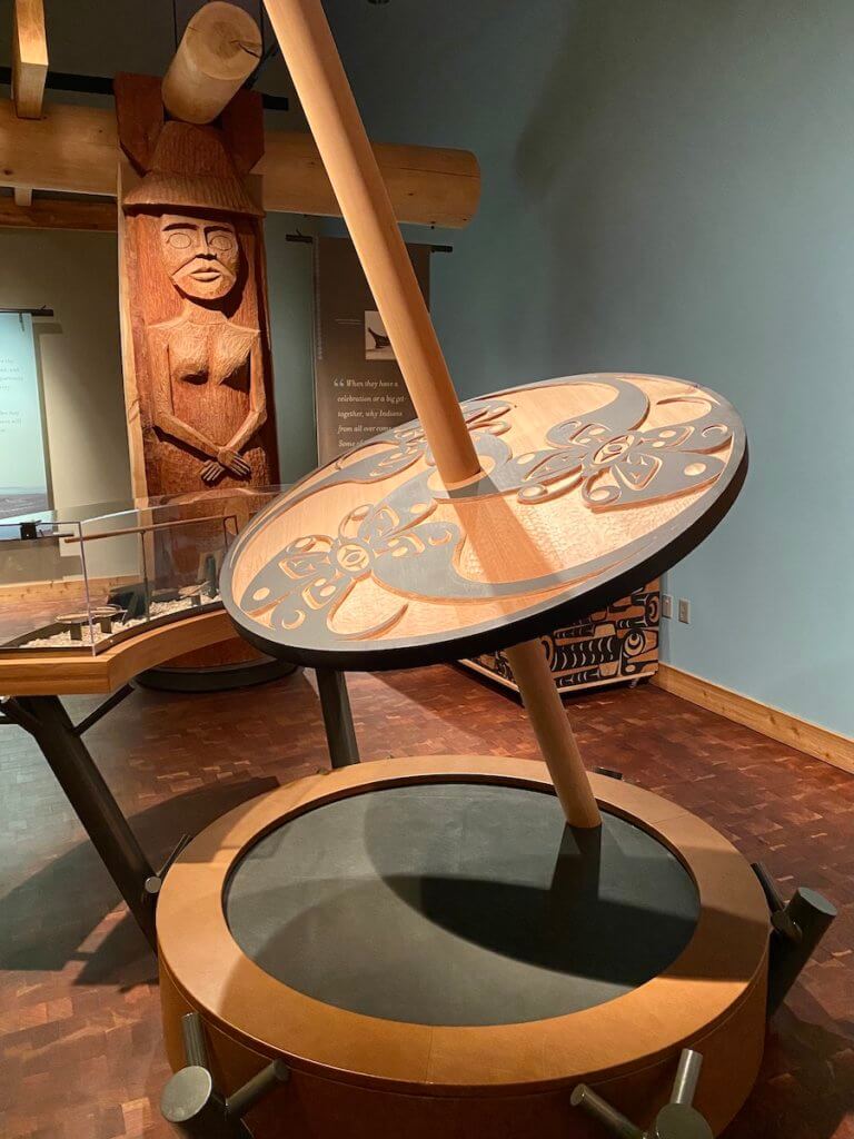 A spindel carved out of cedar and painted with black paint at the entrance to the Suquamish Museum in the Salish Sea.