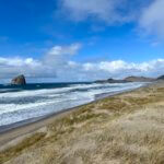 A sweeping view of Pacific City, one of the best Oregon Coast Towns for wide sandy beaches and peace and quiet.