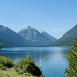 Beautiful Wallowa Lake with deep blue water and rising mountain peaks in the background.