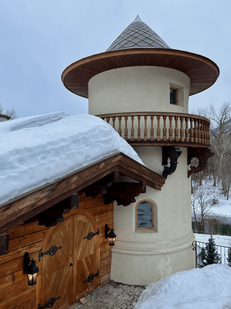 A German looking turret and roof is covered in snow in a hotel in Leavenworth, Washington.