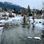 Leavenworth Washington is the perfect location to try a nature forward vacation. The icy Wenatchee River winds through hillsides covered in snow with a scattering of cabins underneath majestic mountains.