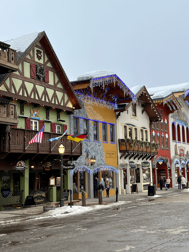 The Bavarian themed town of Leavenworth Washingon is full of charm. This row of storefronts shows the german theme with snow covered roofs.