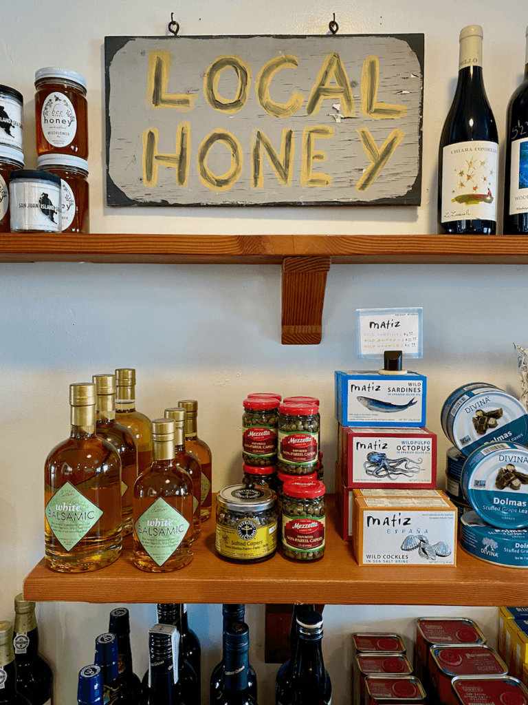 Local Honey for sale in Edison washington on the drive between Seattle and Vancouver. There are selves selling other picnic supplies like sardines, cockles, and octopus and balsamic vinegar.
