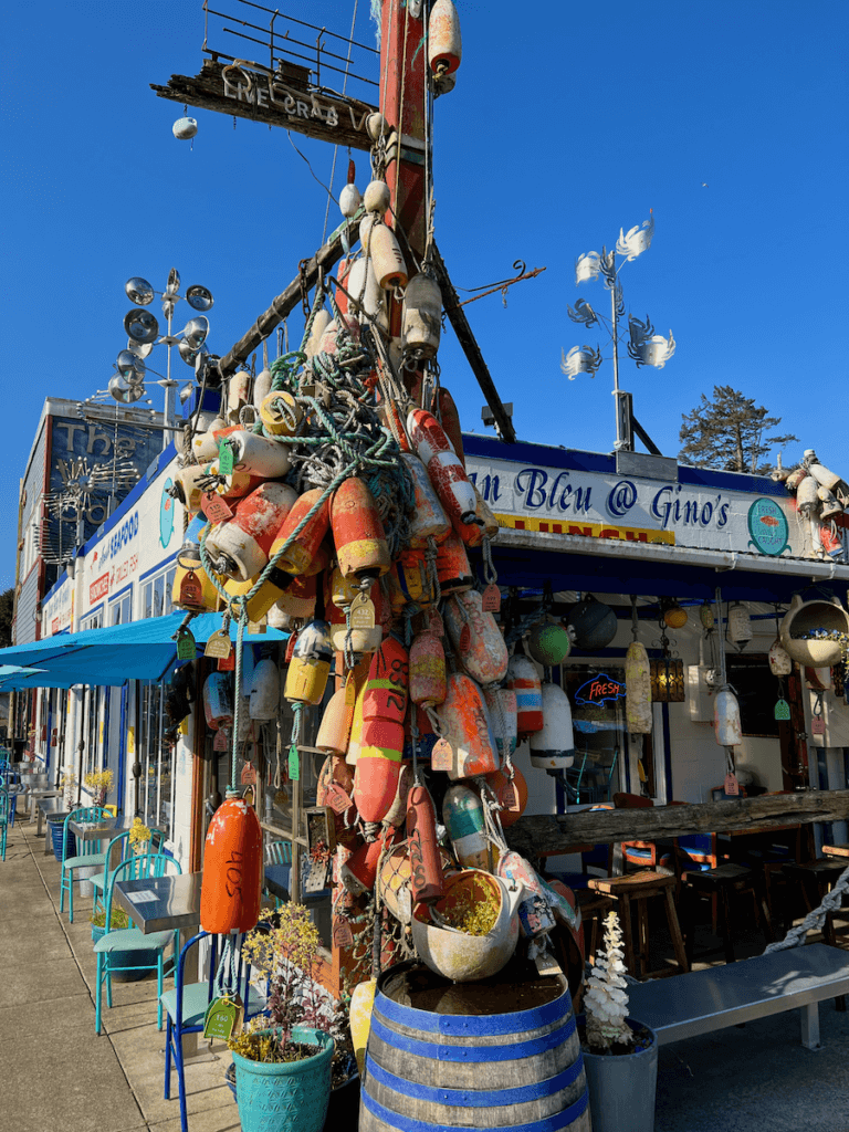 Brightly colored buoys are tied to a lamppost outside Ocean Bleu at Gino's on Newport's bayfront.