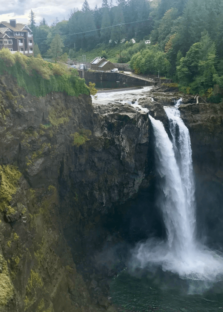 Snowqualimie Falls is a popular day trip destination from Seattle. The powerful force of water creates mist as it hits the floor of the canyon. Perched atop the hill is a hotel and various damming apparatus.